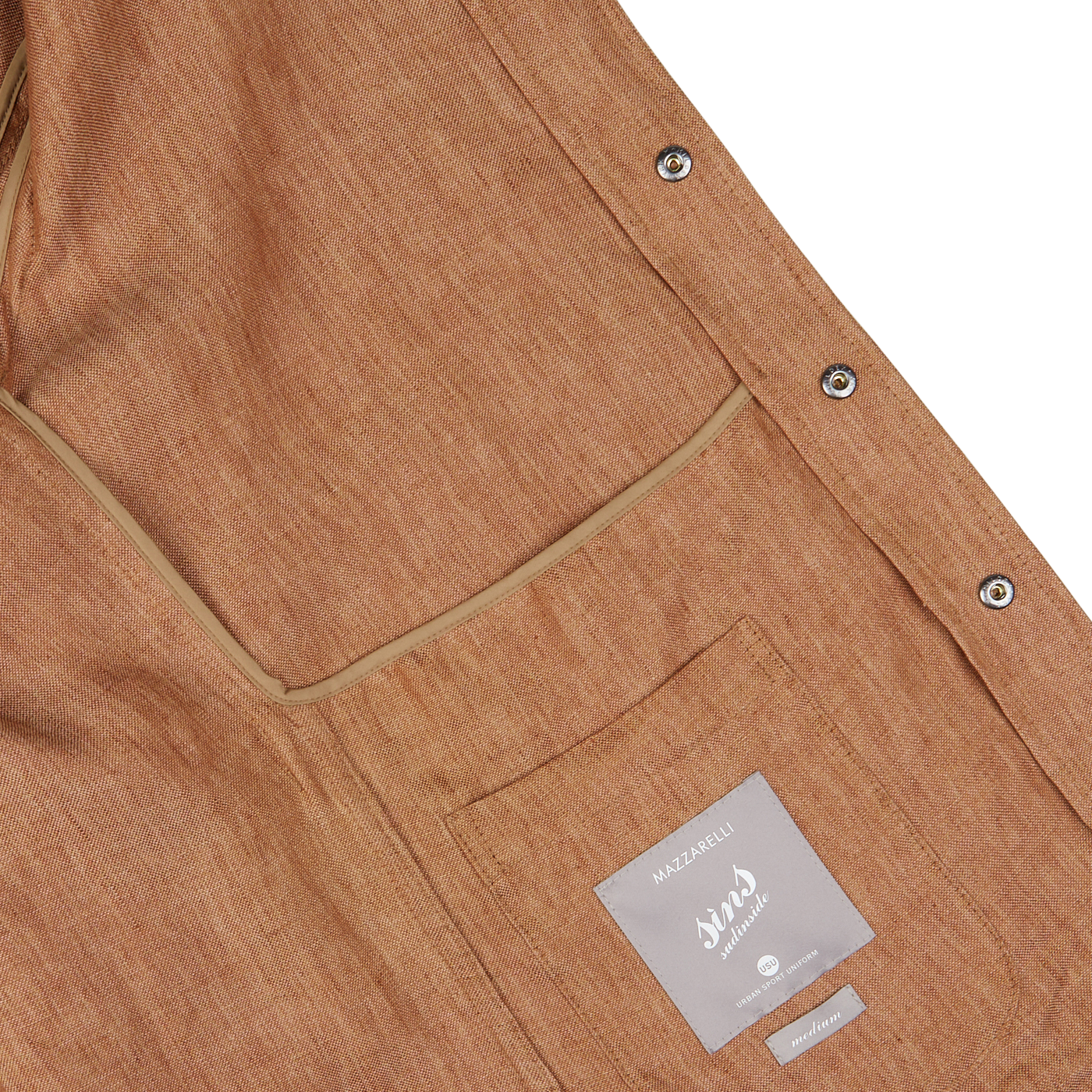 Close-up of a terracotta brown Mazzarelli overshirt with a label and silver buttons.