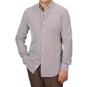 A person wears the White Brown Striped Cotton BD Slim Shirt by Mazzarelli with brown pants, standing against a neutral background.