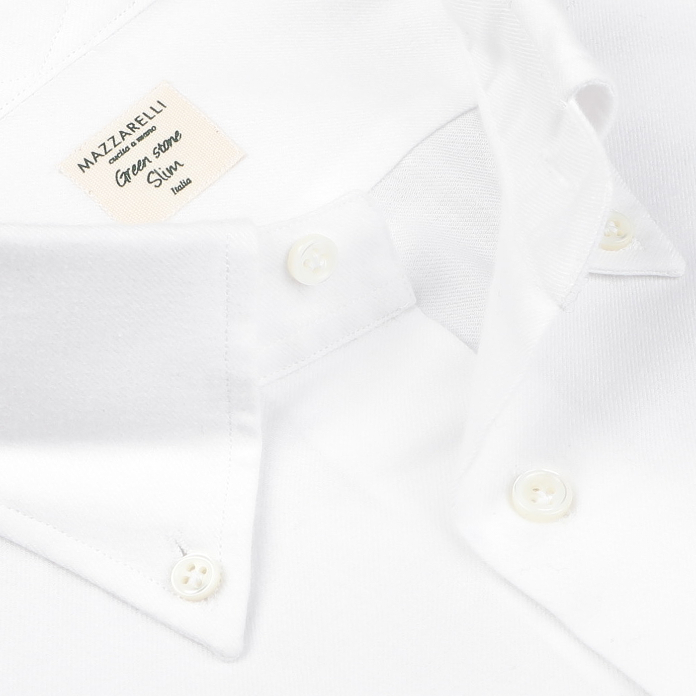 Close-up of a white buttoned-down shirt with a soft collar, crafted by the renowned Italian shirtmaker Mazzarelli. The label reads "Mazzarelli Giovane Sono Slim Italy," and it's named the White Brushed Cotton Twill BD Slim Shirt, made from luxurious brushed cotton twill for exceptional comfort and style.