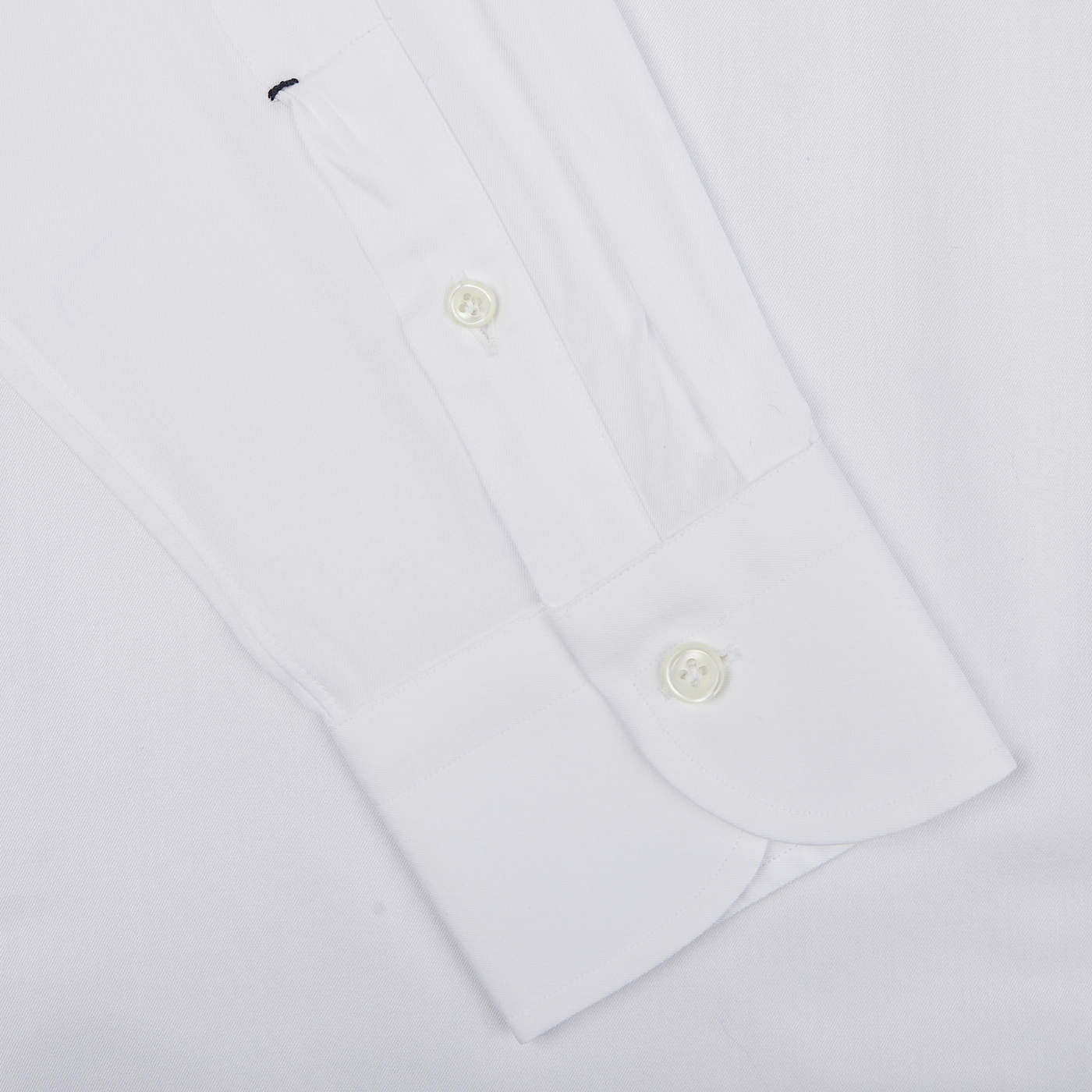 Close-up of a Mazzarelli White Cotton Twill Cutaway Slim Shirt with a placket front, showing two visible buttons and button-down cuffs.