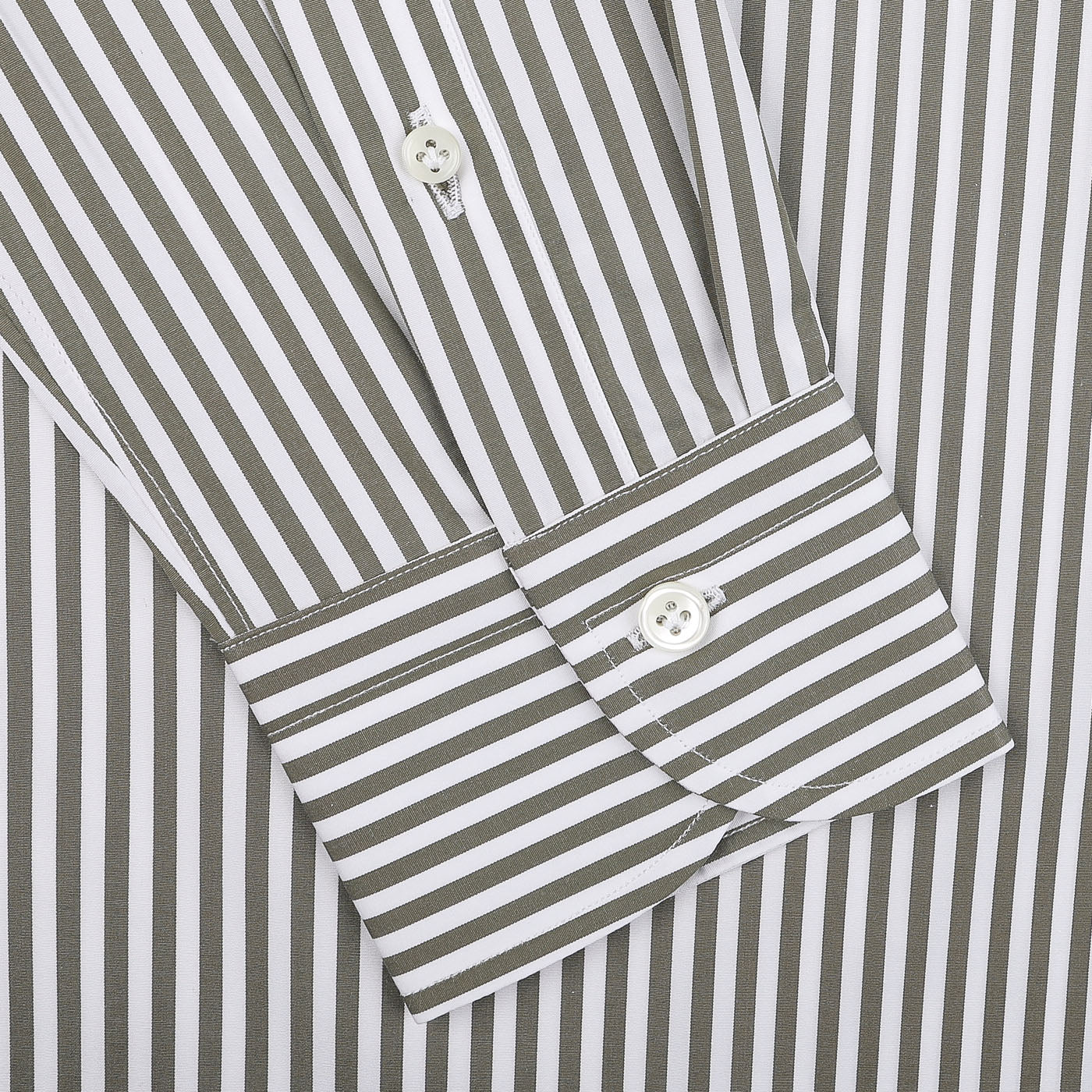 Close-up of a sleeve from the Mazzarelli White Green Striped Cotton BD Slim Shirt, showcasing its vertical green and white stripes in pure cotton, complete with a cuff and pristine white buttons.