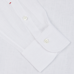 Close-up of an Italian shirtmaker Mazzarelli White Organic Linen BD Slim Shirt cuff with buttons.