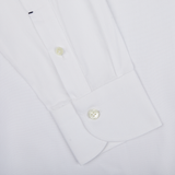 Close-up of a Mazzarelli White Royal Oxford BD Slim Shirt cuff with two buttoned buttons.