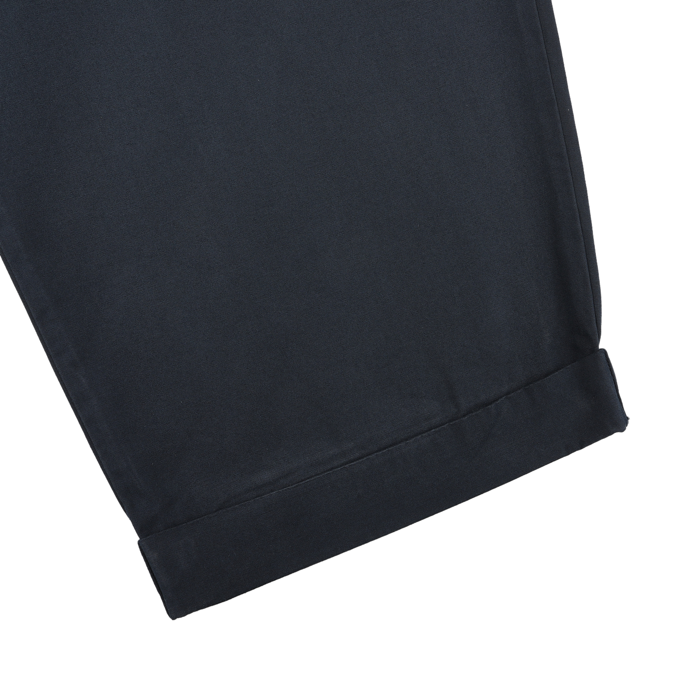 Close-up of the hem and cuff of a pair of Navy Blue Cotton Poplin 03 Pants by Merz b. Schwanen, crafted from organic cotton for comfort, laid flat on a white surface.