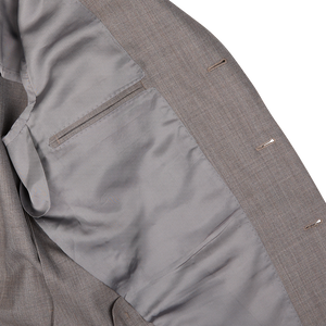 Close-up of a Ring Jacket mid gray high-twist wool suit jacket with visible pocket and seam details.