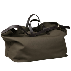 The Army Dark Brown M/S Haven Weekend Bag by Mismo features a spacious olive-green canvas design with dark brown leather handles and a shoulder strap.