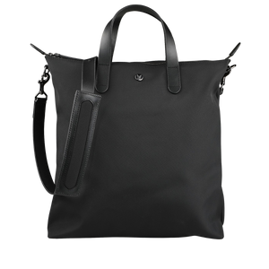 The Eclipse Black M/S Nylon Shopper by Mismo is a black tote bag made from smooth ballistic nylon, with two handles and an adjustable shoulder strap, all set against a neutral background.