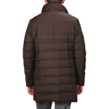 Back view of a person wearing a Montecore Brown Super 120s Wool Batavia Padded Coat with a high collar. Only the upper body is visible against a neutral gray background.