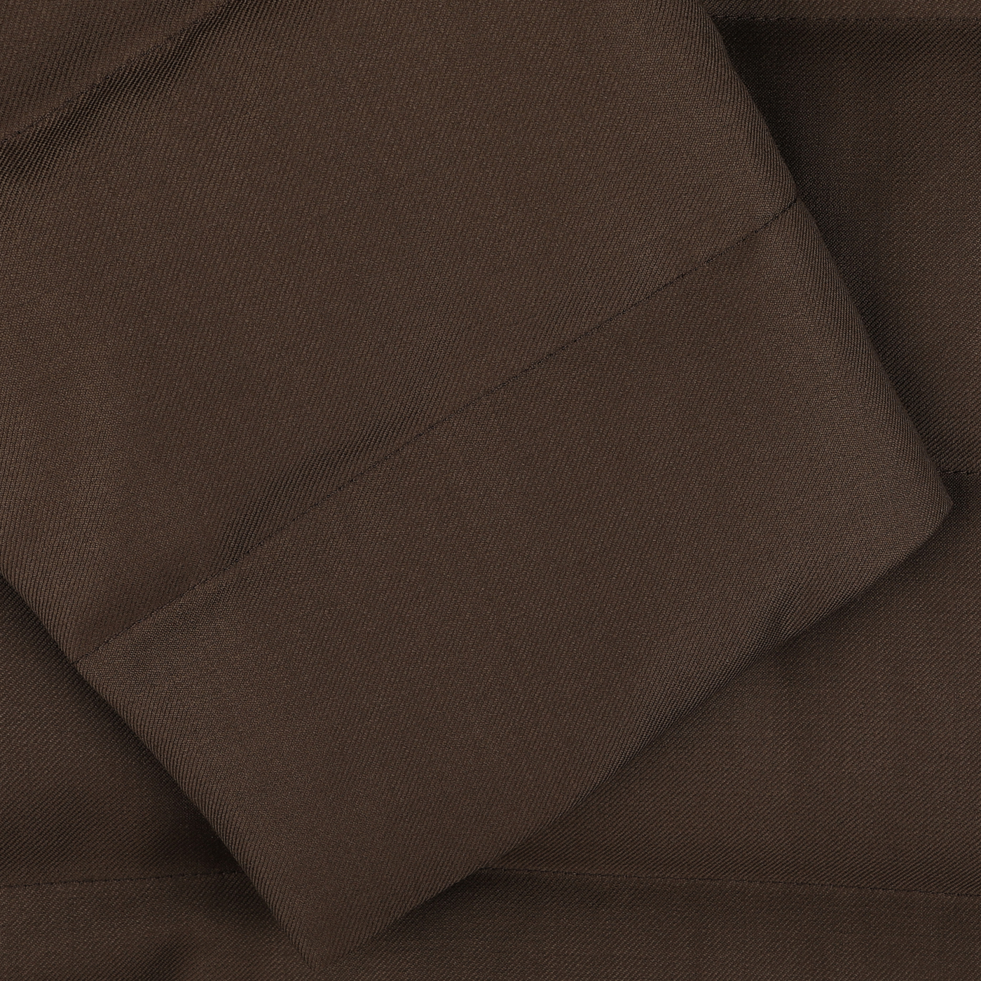 Close-up of brown Super 120s wool fabric with a folded edge, reminiscent of the luxurious textures found in Italian outerwear, like the Batavia Padded Coat from Montecore.