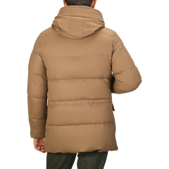 A person is wearing a Camel Beige VBC Wool Flannel Padded Parka with a hood, viewed from the back. This stylish piece, crafted by Montecore, showcases the excellence of Italian outerwear specialists.