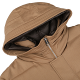 Close-up of a Camel Beige VBC Wool Flannel Padded Parka by Montecore with a partially unzipped front, revealing a dark inner lining. The hood is laid flat, showcasing the craftsmanship of this Italian outerwear specialist.