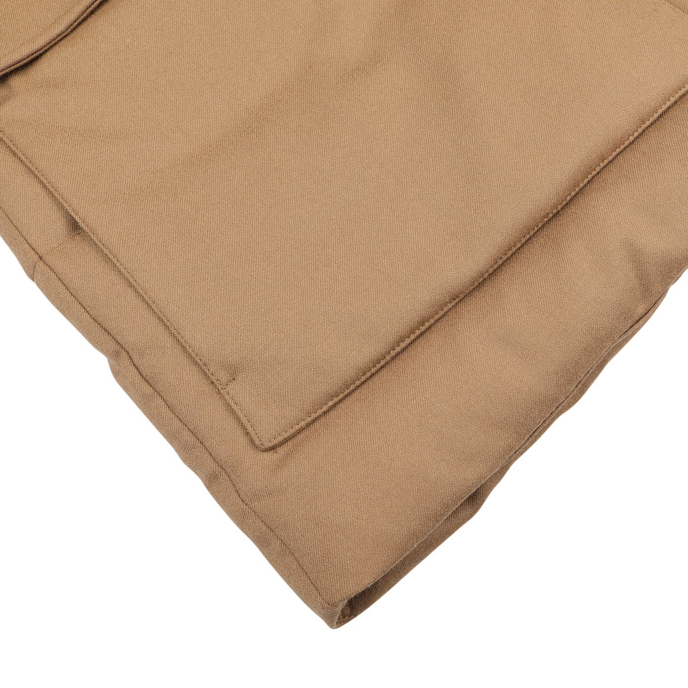 Close-up view of the folded Camel Beige VBC Wool Flannel Padded Parka by Montecore, showcasing visible stitching on a white background.