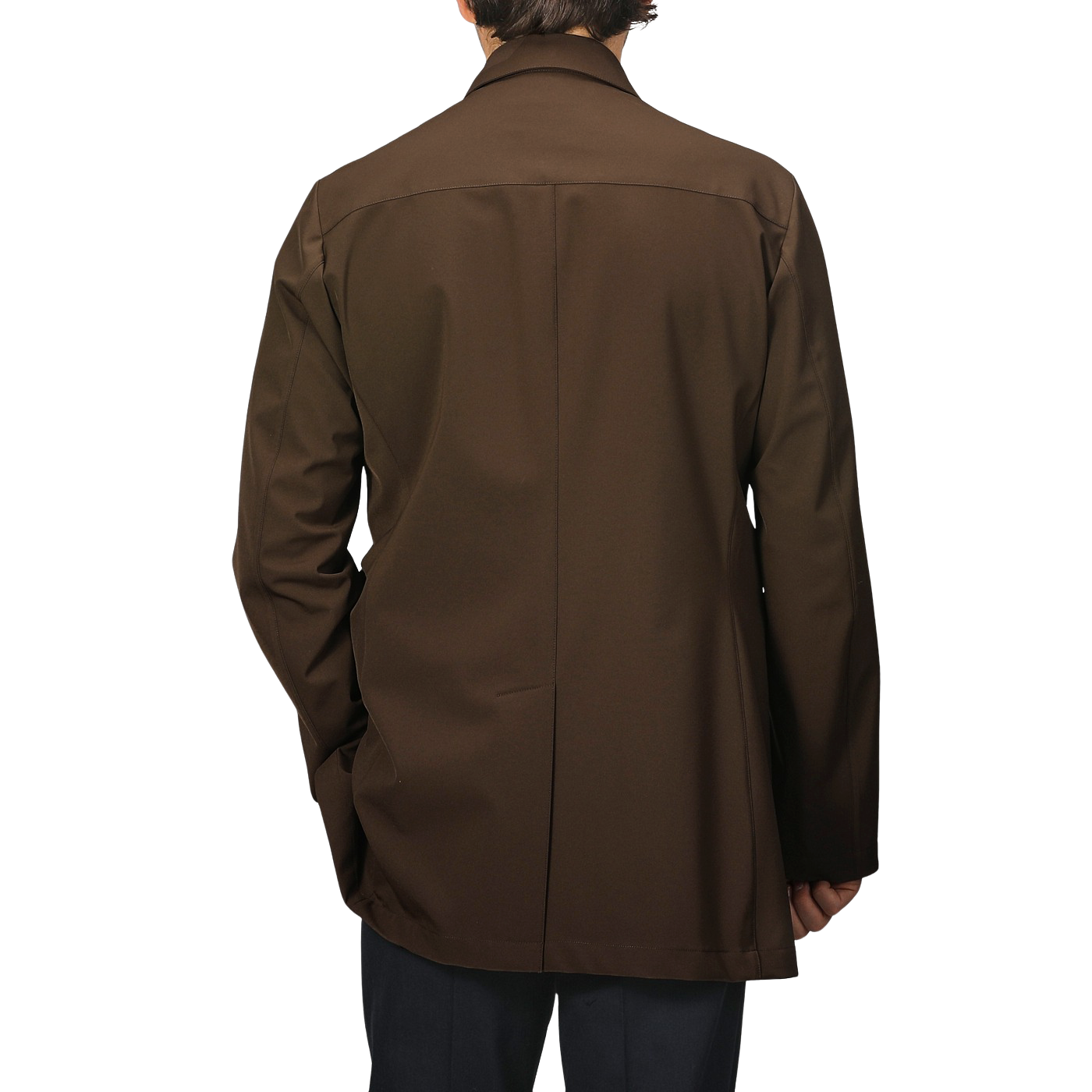 A man wearing the Dark Brown Aéro Twill Car Coat by Montecore exudes sophistication, reminiscent of sleek Italian outerwear.