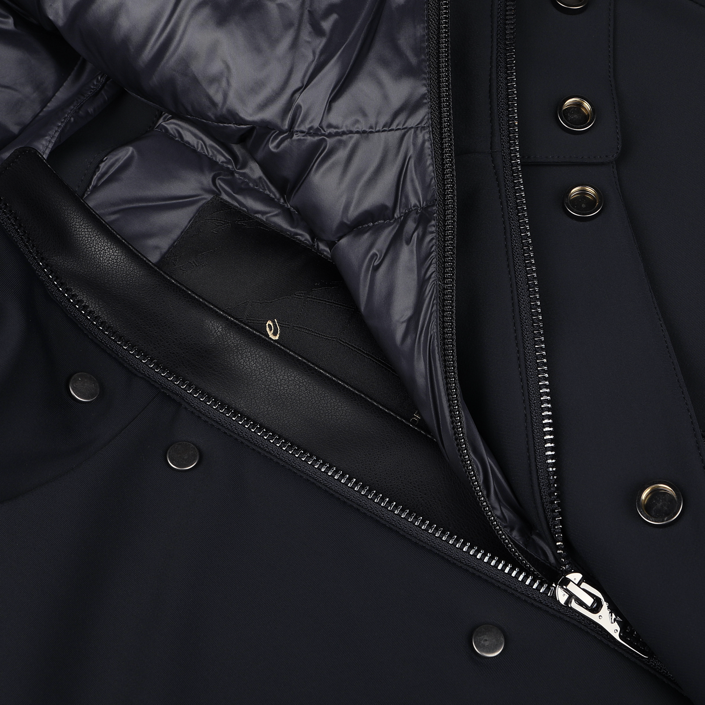 Close-up image of the Montecore Navy Blue Nylon Technical Padded Car Coat showcasing a partially zipped front, metal snap buttons, and a puffy inner lining.