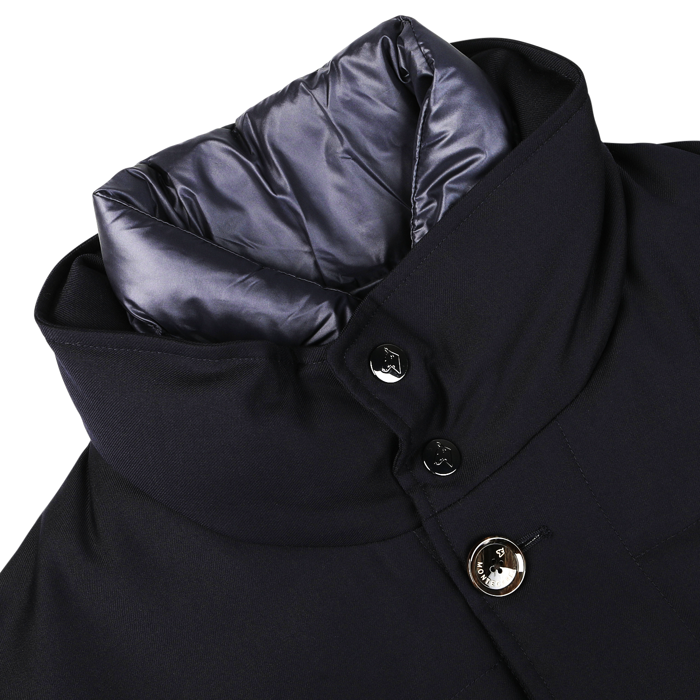 Close-up of a navy blue Montecore outerwear winter coat made from Super 120s wool with a high collar, showing detailed stitching, two buttons, and a partially visible gray inner lining.