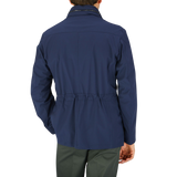 The back view of a man wearing a Dark Blue Lightweight Nylon Field Jacket by Moorer.