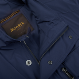 A close up of a water-resistant Dark Blue Lightweight Nylon Field Jacket with the word Moorer on it.