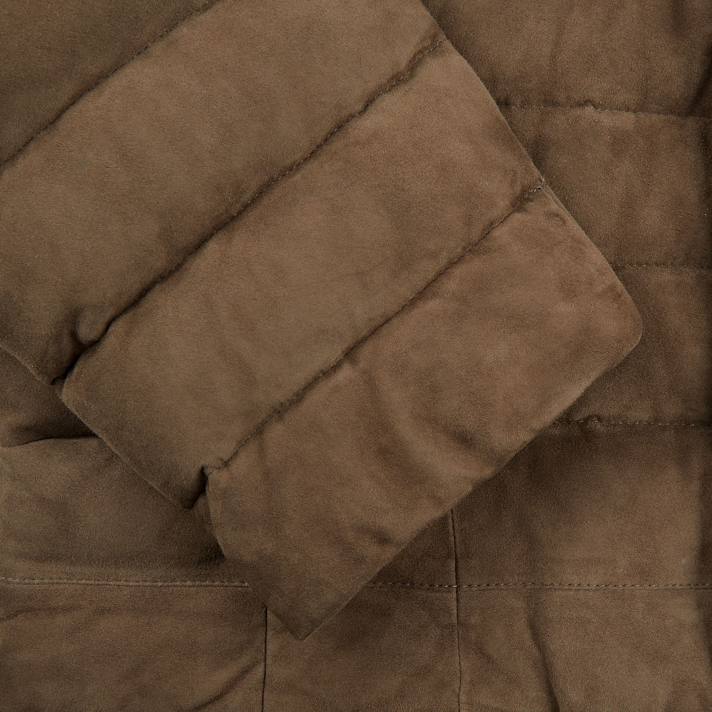 A close up of a dark taupe suede leather Moorer jacket showcasing expert craftsmanship.