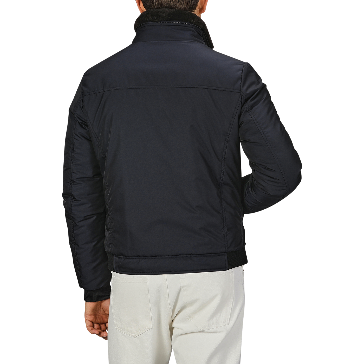 Back view of an individual wearing a Moorer Navy Blue Nylon Down Padded Blouson with a high collar and white pants, standing against a plain background.