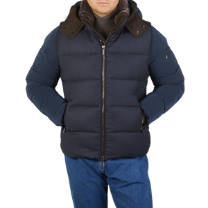 An Italian man wearing a Moorer Navy Blue Nylon Down Padded Quilted Jacket, which is weather-resistant.