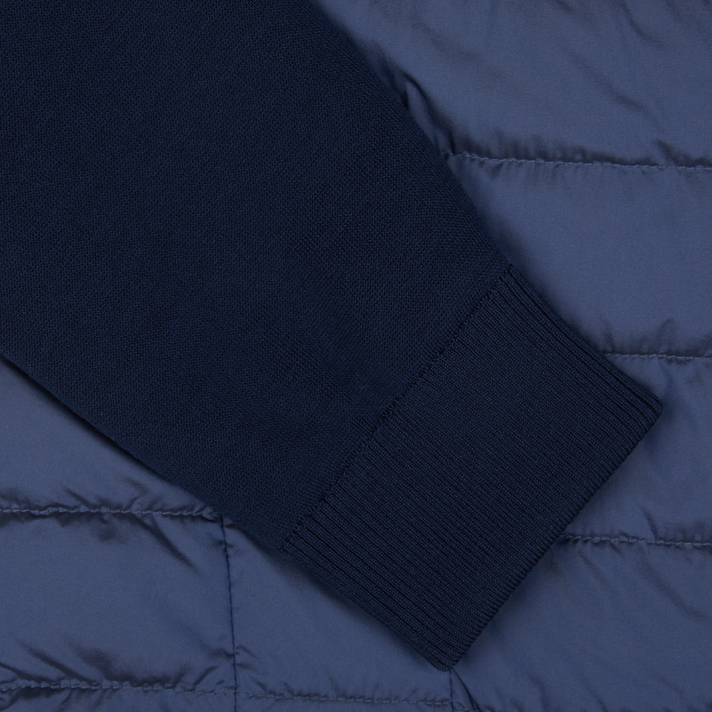 A close up of a Moorer Ocean Blue Nylon Knitted Sleeve Jacket.