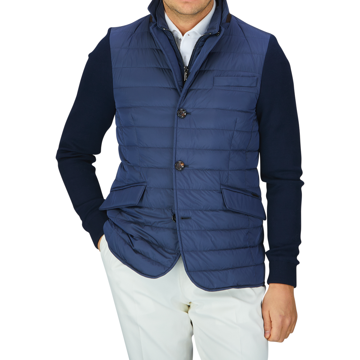 A man wearing a Moorer Ocean Blue Nylon Knitted Sleeve Jacket and white pants.