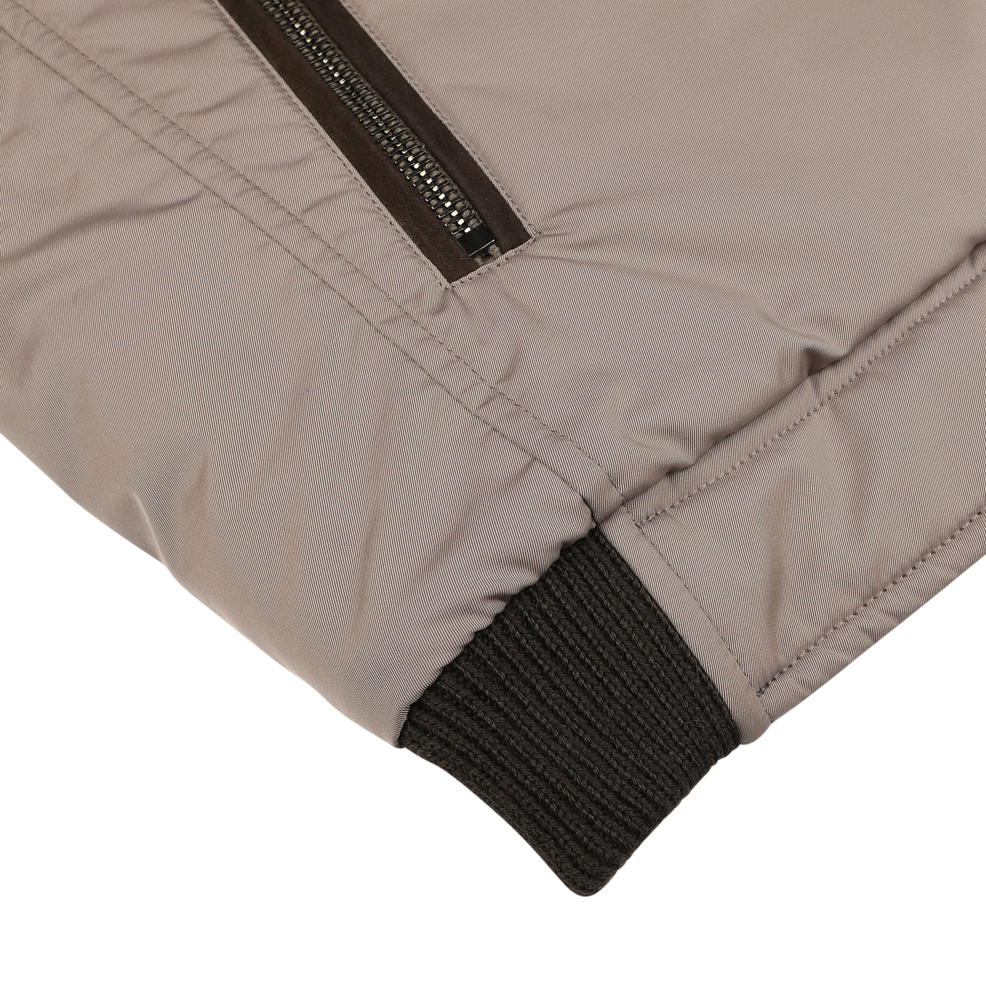 Close-up of a Taupe Beige Nylon Down Padded Blouson sleeve by Moorer, featuring a black ribbed cuff and a zippered pocket, showcasing the craftsmanship of Italian outerwear.