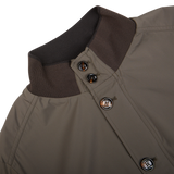 Close-up of a luxurious Olive Green Technical Nylon Blouson jacket collar with buttons by Moorer.