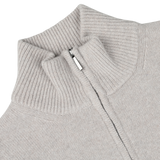 Close-up of the Taupe Beige Wool Cashmere Quarter Zip by Morgano, an Italian knitwear specialist, featuring a high collar and crafted from sumptuous merino wool and cashmere.