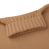 A close up of a Morgano Camel Beige Heavy Merino Wool Rollneck sweater.