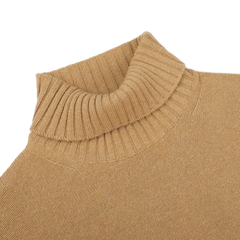 A close-up of a Camel Beige Heavy Wool Cashmere Rollneck sweater by Morgano, featuring a ribbed collar, laid flat against a white background.