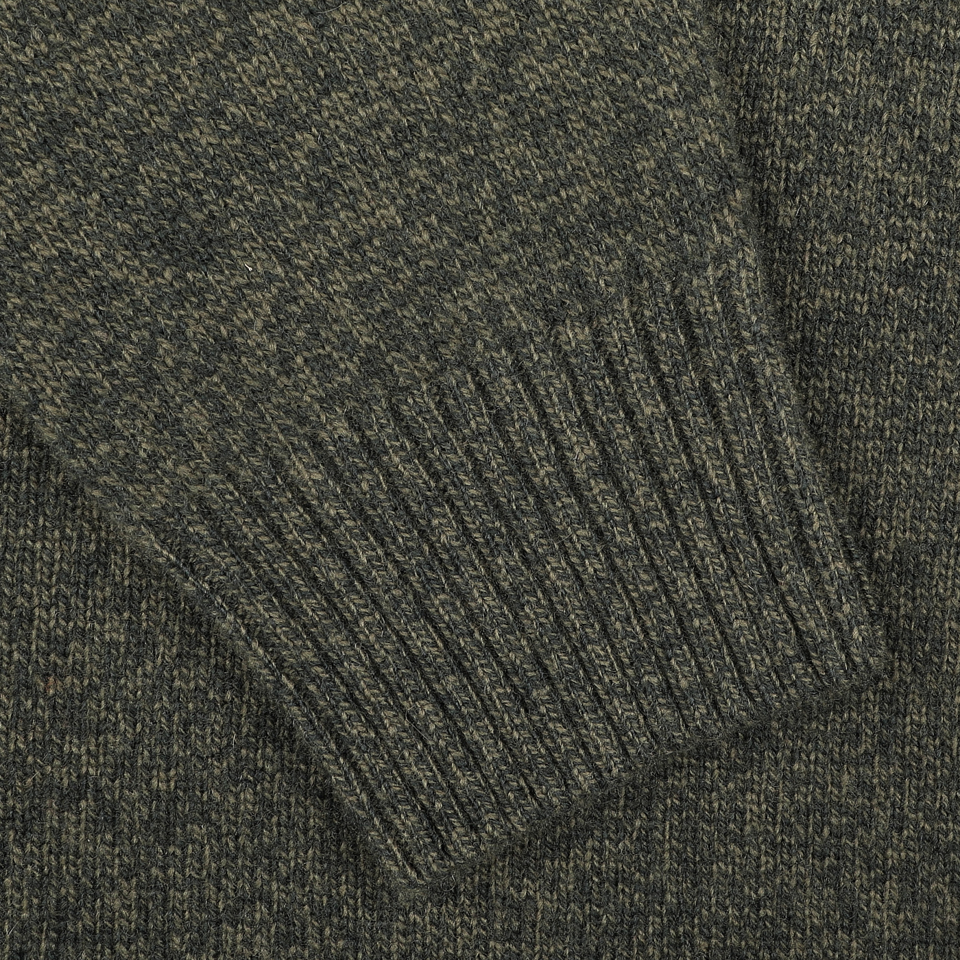 Close-up of the ribbed cuff on the Green Melange Heavy Wool Cashmere Rollneck by Morgano.