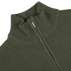 Close-up of the Moss Green Wool Cashmere Quarter Zip by Morgano, showcasing its ribbed knit material and metal zipper, epitomizing the quality expected from an Italian knitwear specialist.