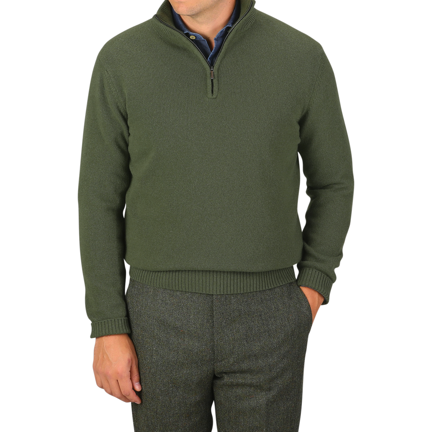 A man wearing the Moss Green Wool Cashmere Quarter Zip by Morgano, crafted from luxurious Italian knitwear, stands with one hand in his pocket against a plain gray background.