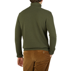 The back view of an Italian man wearing a Morgano Moss Green Heavy Wool Cashmere Rollneck.