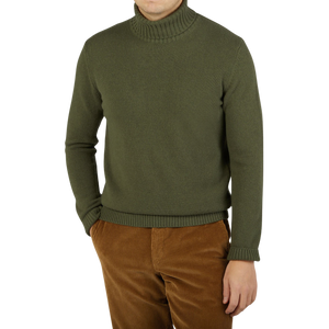 A man wearing a Moss Green Heavy Wool Cashmere Rollneck by Morgano.