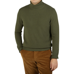 A man wearing a Moss Green Heavy Wool Cashmere Rollneck by Morgano.