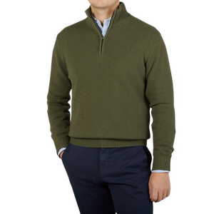 A man wearing a Morgano Moss Green Wool Cashmere Quarter-Zip Sweater.
