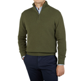 A man wearing a Morgano Moss Green Wool Cashmere Quarter-Zip Sweater.