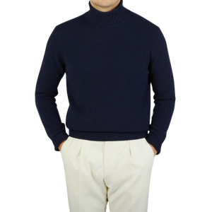 A man wearing a Morgano Navy Blue Heavy Wool Cashmere Rollneck sweater.