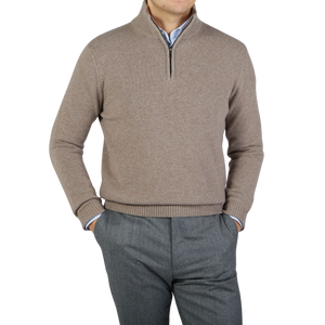 A man wearing a Morgano walnut brown wool cashmere quarter-zip sweater.