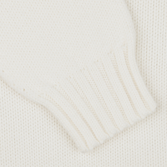 Close-up of the Ecru White Merino Wool Garbis Sweater with a ribbed cuff, from Nitto.