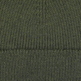 Close-up image of the Khaki Green Merino Wool Ara Beanie from Nitto, showcasing the detailed ribbed texture of the fabric.