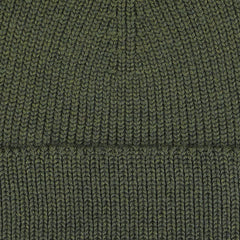 Close-up image of the Khaki Green Merino Wool Ara Beanie from Nitto, showcasing the detailed ribbed texture of the fabric.