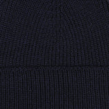 Close-up image of a Marine Blue Merino Wool Ara Beanie, crafted by Nitto.