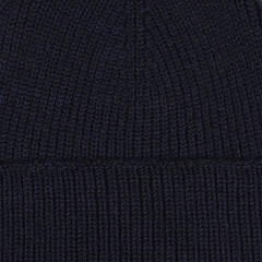 Close-up image of a Marine Blue Merino Wool Ara Beanie, crafted by Nitto.