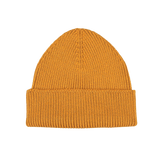 Introducing the Ocre Yellow Merino Wool Ara Beanie by Nitto: a mustard yellow knitted masterpiece with a folded brim, crafted by knitwear specialists. Made from luxurious merino wool, it promises both style and warmth.