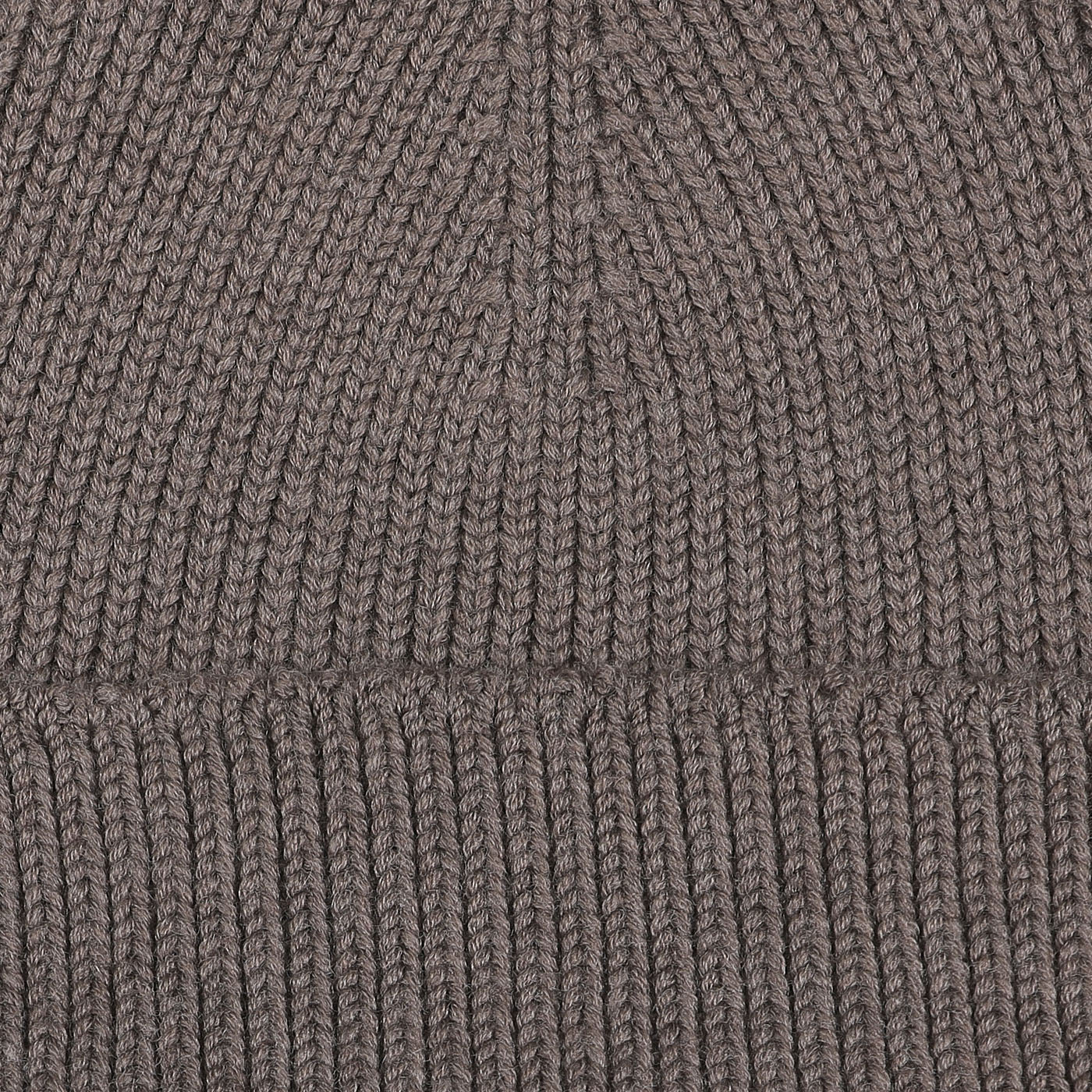 Close-up of a Taupe Grey Merino Wool Ara Beanie, showcasing the texture and stitching pattern crafted by Nitto.