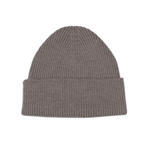 The Taupe Grey Merino Wool Ara Beanie by Nitto is a stylish knit accessory made from soft merino wool, featuring a folded brim and showcased against a plain white background.