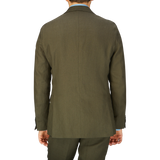 Rear view of a person wearing a formal Green Leaf Pure Linen Suit jacket by Oscar Jacobson.